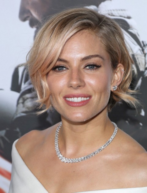 ... Short Haircut: Soft Wavy Hairstyle with Side-Swept Bangs /Getty Images