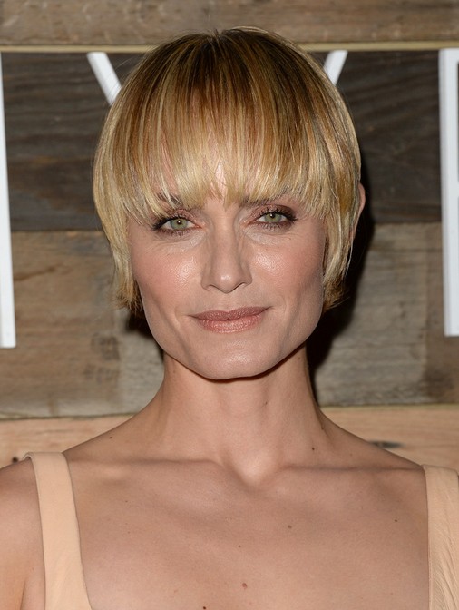 Short Haircuts for Older Women: Amber Valletta Layered Hairstyle with Blunt Bangs