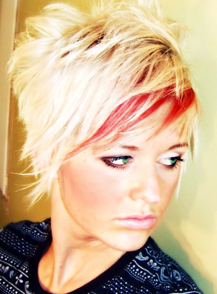 Crazy shaggy cut. Platinum blonde with red highlight at the bang for fun. Washes out to a sweet pink!