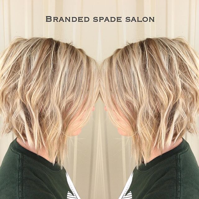 Side view of short blonde angled bob hairstyle